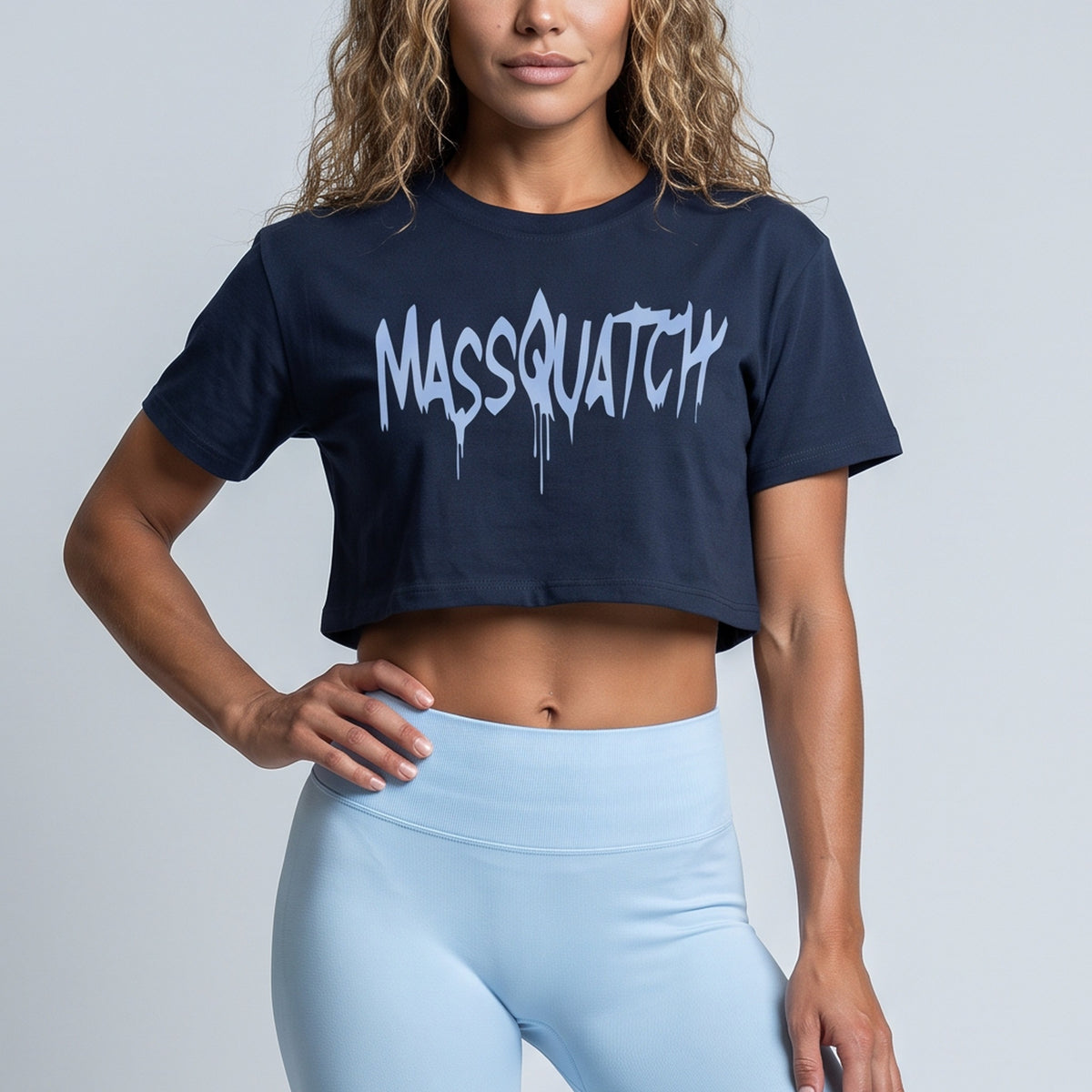 Navy baby tee with an Ice Blue drip logo, print close-up