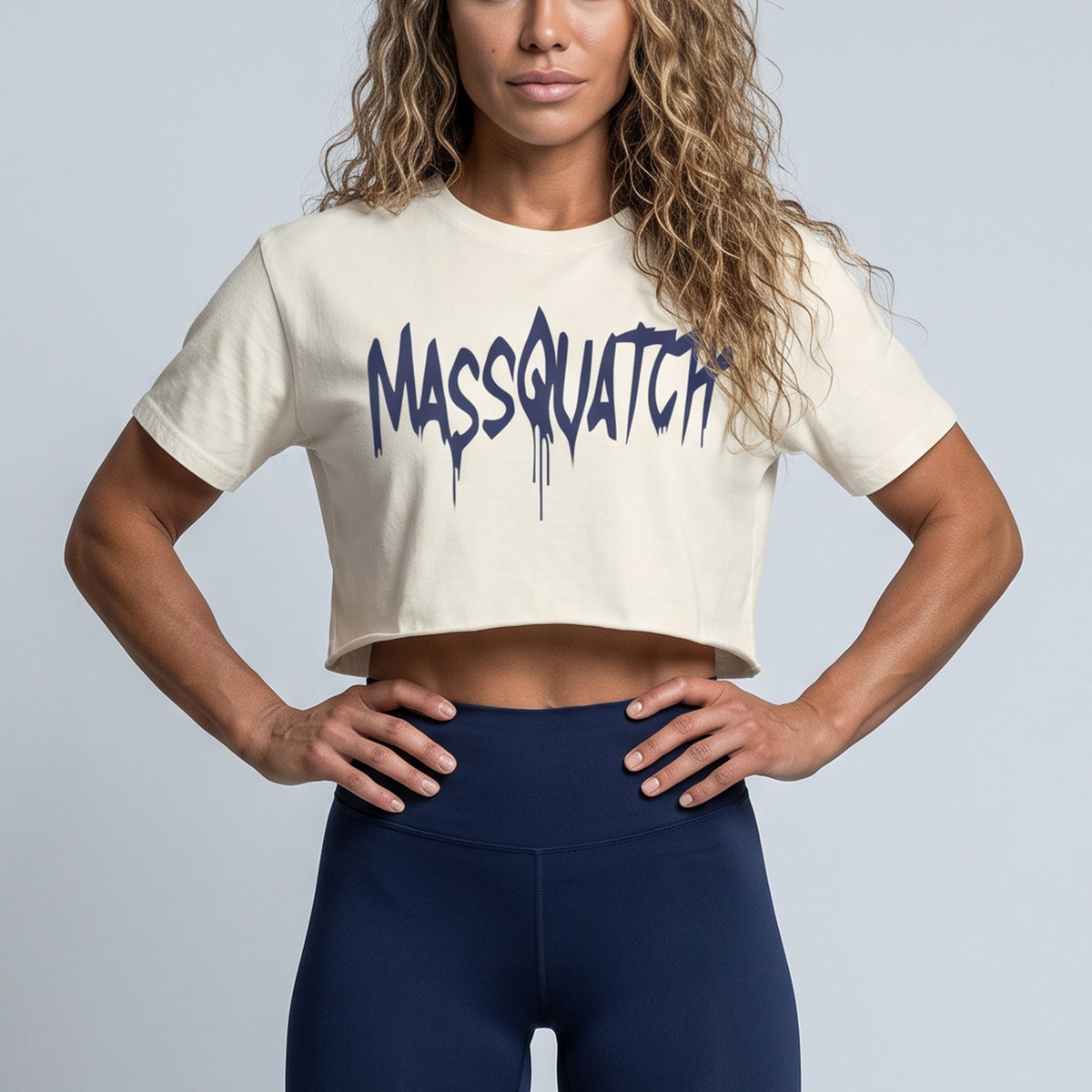 Ecru baby tee with a Dark Navy Blue drip logo, print close-up