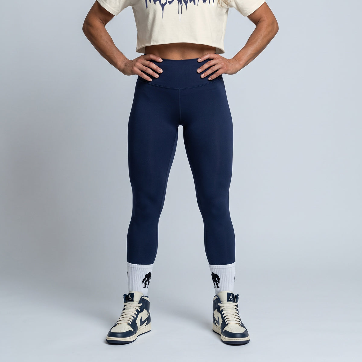 Ecru baby tee with a Dark Navy Blue drip logo, full outfit