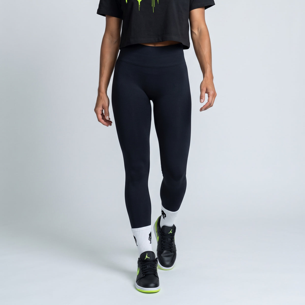Black baby tee with a Hazard Lime drip logo, full outfit