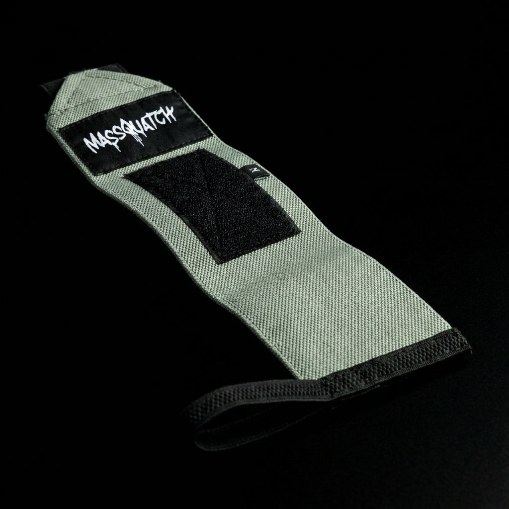 Massquatch Wrist Straps – flat lay, sage green canvas, MASSQUATCH logo, black velcro